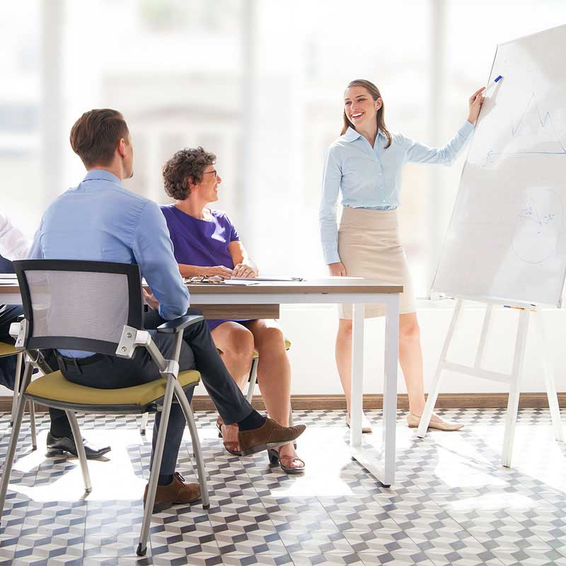 Woman Pointing to Whiteboard